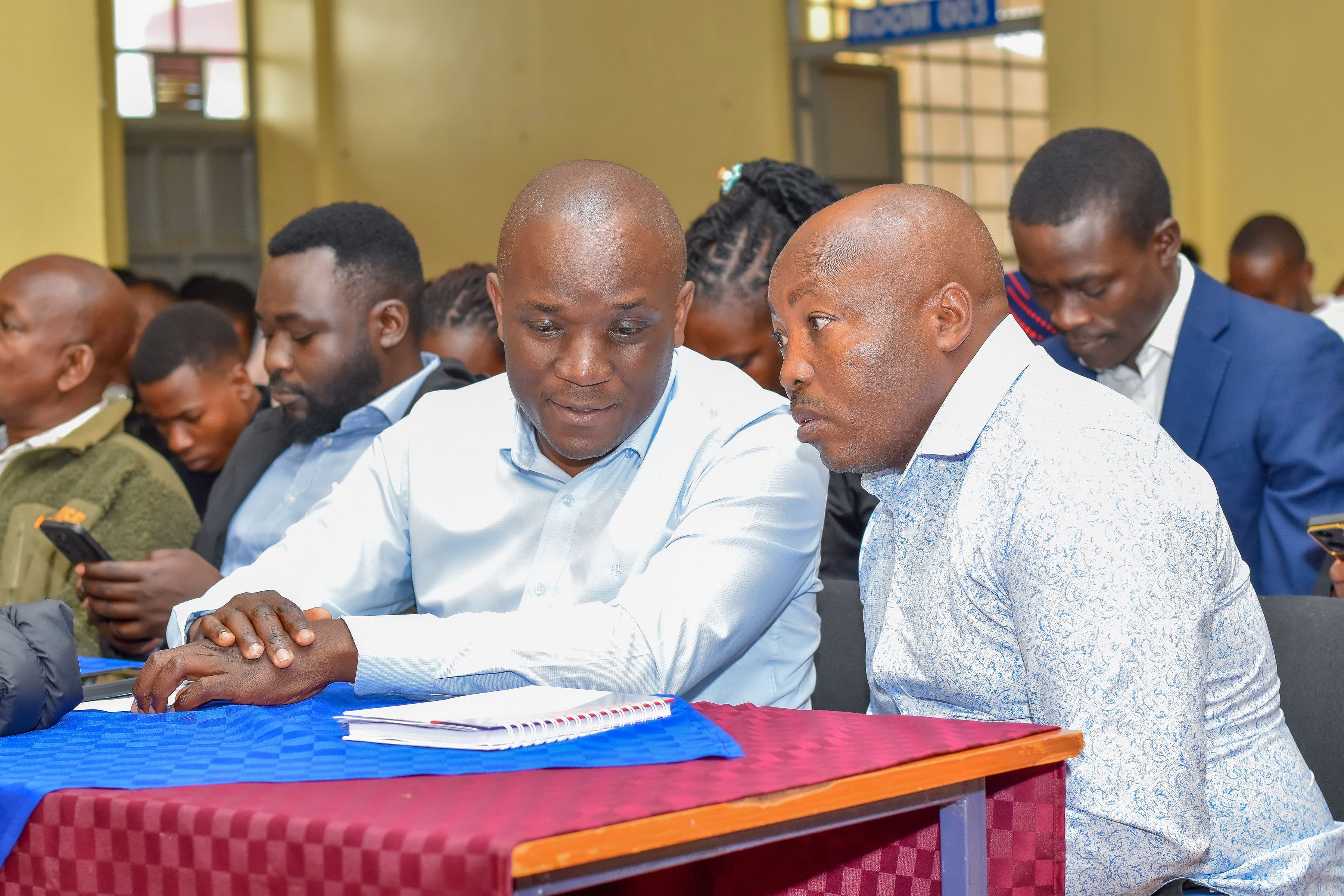 Dr. Malanga(left) and the Principal Kiharu TVC(right) in consultation.