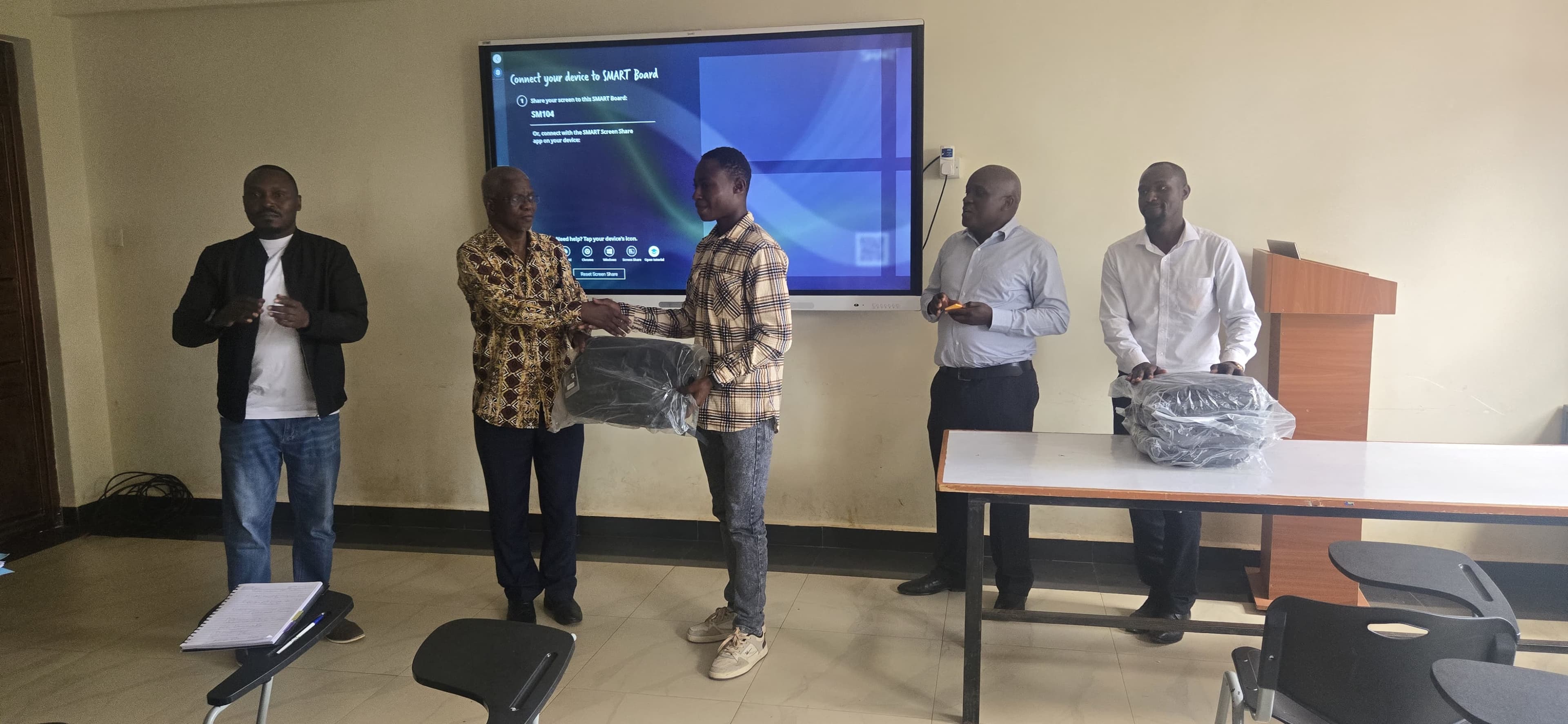 Eric Wanambisi one of the animator being recognized for his contributions and receiving gifts in appreciation of his work.